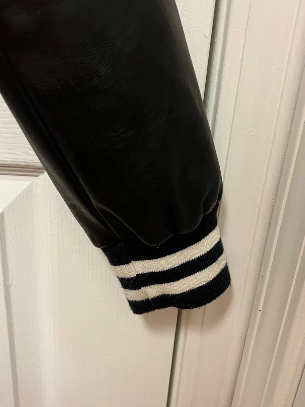 Levi Strauss & Co. Black and White Varsity Jacket with Vegan Leather Sleeves